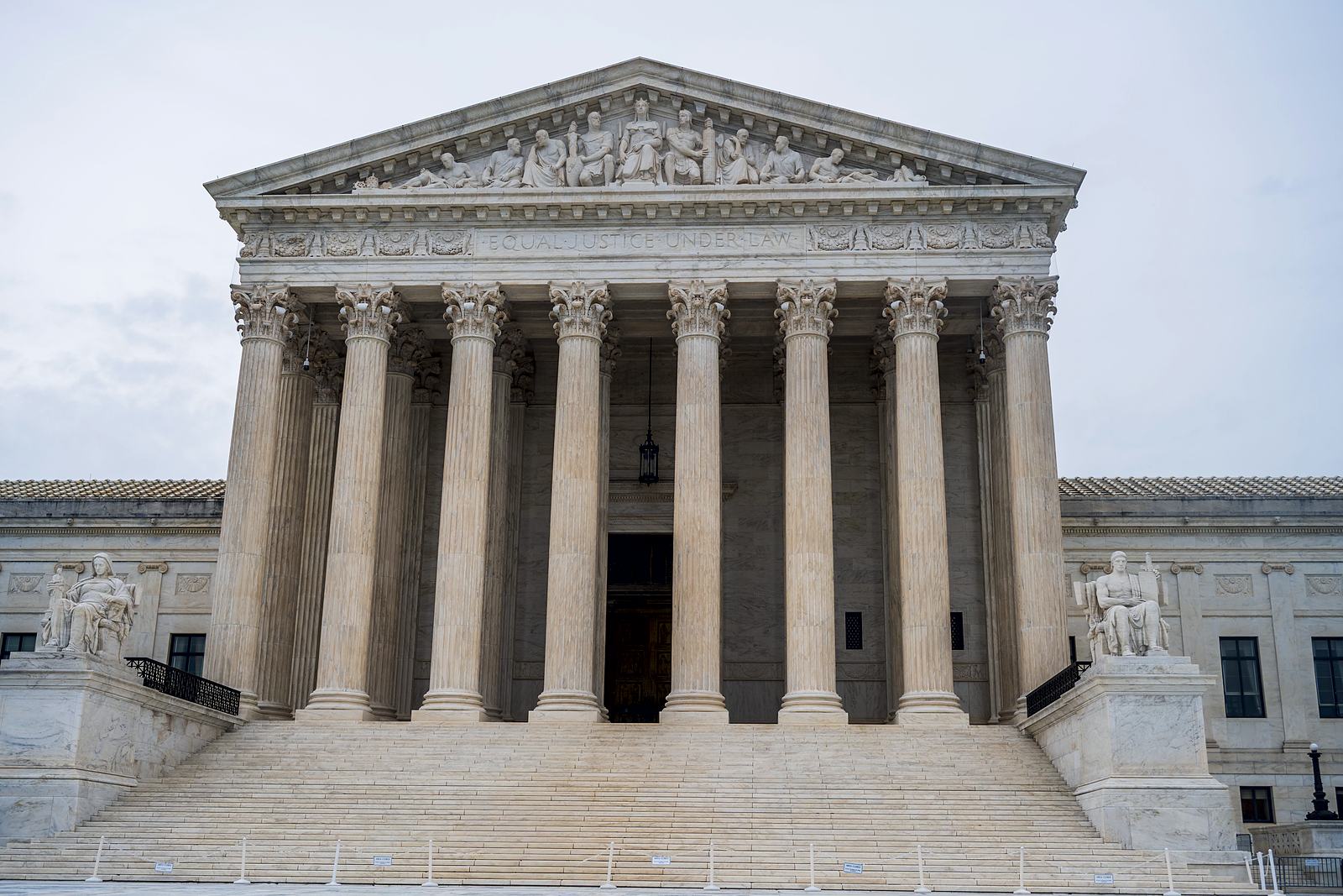 The marble front of the U.S. Supreme Court in Washington, D.C.: a Corinthian colonnade under a pediment, above a broad flight of steps.